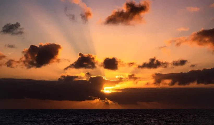 The sun sets, on the way to the Amsterdam Island, part of the five administrative districts of the French Southern and Antarctic Territories, on December 28, 2022. - The research station at Martin-de-Vivies, is the only settlement on the island and is the seasonal home to about thirty researchers and staff studying biology, meteorology, and geomagnetics. The island is home to the endemic Amsterdam albatross. Purest air on earth. Amsterdam is a world benchmark for atmospheric analysis. The site has exceptional qualities: distance of more than 3,000 km from any continent and any human activity. In this area of the southern hemisphere, the air masses are particularly pure and mixed because depressions can easily circumnavigate the island without being stopped. (Photo by Patrick HERTZOG / AFP) (Photo by PATRICK HERTZOG/AFP via Getty Images)