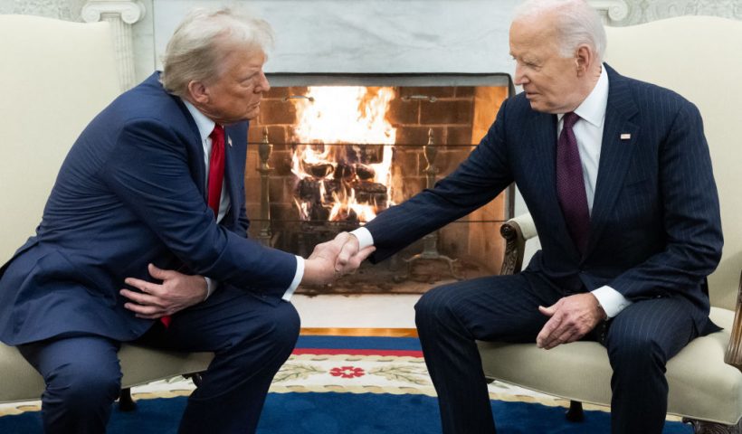 TOPSHOT - US President Joe Biden shakes hands with US President-elect Donald Trump during a meeting in the Oval Office of the White House in Washington, DC, on November 13, 2024. Trump thanked Biden for pledging a smooth transfer of power as the victorious Republican made a historic return visit to the White House on Wednesday. (Photo by SAUL LOEB / AFP) (Photo by SAUL LOEB/AFP via Getty Images)