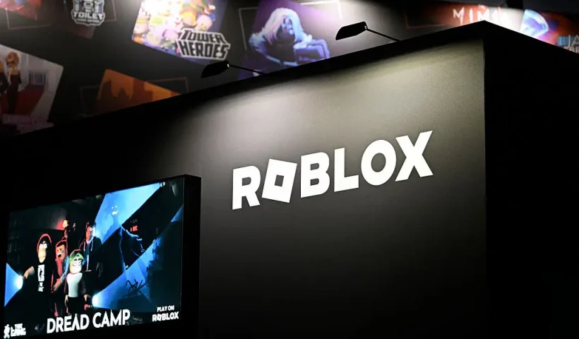 A photo shows the logo of online game platform and game creation system Roblox at their booth during at the Gamescom video games trade fair at the Trade Fair Center in Cologne, western Germany, on August 21, 2025. The 2025 edition of the vast Gamescom trade fair in Cologne, Germany, had its opening night on August 19, 2025 and will be running from August 20 to 24, 2025. (Photo by Ina FASSBENDER / AFP) (Photo by INA FASSBENDER/AFP via Getty Images)