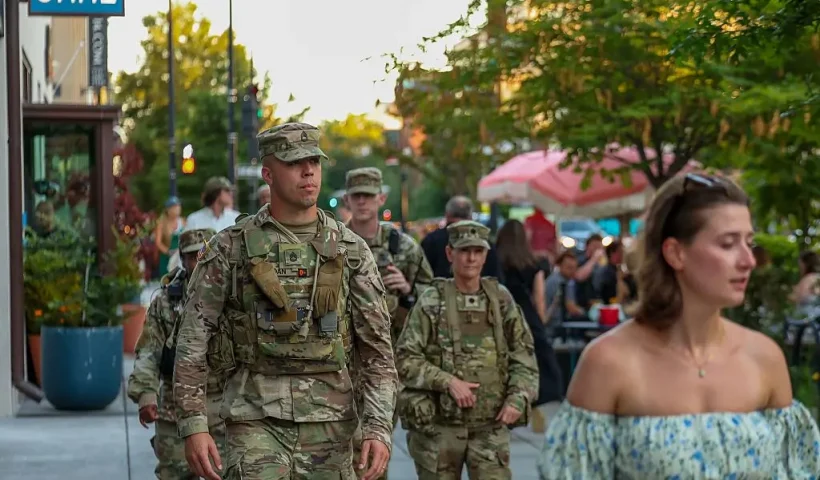 WASHINGTON, DC - AUGUST 22: Members of the National Guard patrol the 14 Street restaurant and nightlife area on August 22, 2025 in Washington, DC. An increased presence of law enforcement has been seen throughout the nation's capital since U.S. President Donald Trump announced plans to deploy federal officers and the U.S. National Guard. (Photo by Tasos Katopodis/Getty Images)