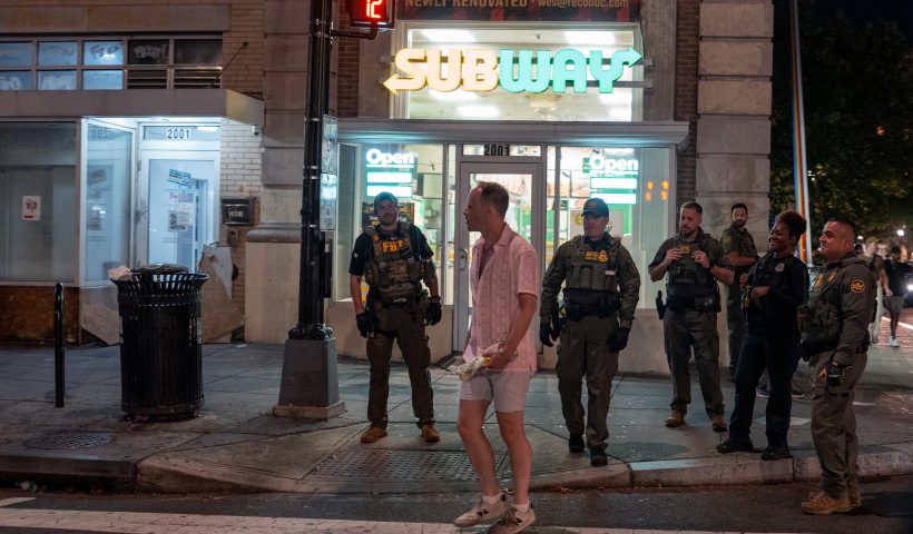 WASHINGTON, DC - AUGUST 10: FBI and Border Patrol officers speak with Sean Charles Dunn, after he allegedly assaulted law enforcement with a sandwich, along the U Street corridor during a federal law enforcement deployment to the nation's capital on August 10, 2025 in Washington, DC. U.S. President Donald Trump ordered an increased presence of federal law enforcement in Washington, DC, in an effort to curb crime. (Photo by Andrew Leyden/Getty Images).