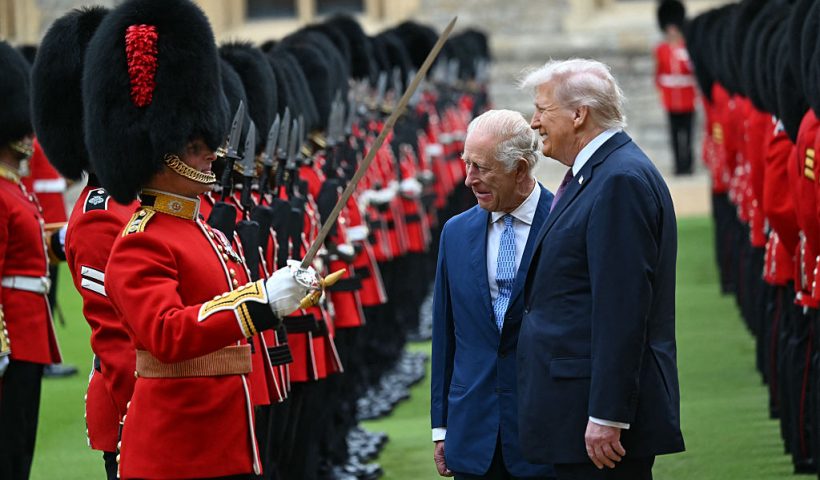 Britain's King Charles III (C) and US President Donald Trump (R) talk with a Coldstream Guardsman as they inspect the guard of honour during a ceremonial welcome in the Quadrangle at Windsor Castle, in Windsor, on September 17, 2025, during the US president's second State Visit. US President Donald Trump arrived in Britain for an unprecedented second State Visit, with the UK government rolling out a royal red carpet welcome to win over the mercurial leader. (Photo by ANDREW CABALLERO-REYNOLDS / AFP) (Photo by ANDREW CABALLERO-REYNOLDS/AFP via Getty Images)