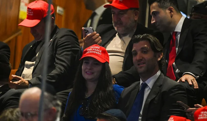 JERUSALEM - OCTOBER 13: People wearing caps tcap read "Trump The Peace President" before President Donald Trump speaks to the Knesset, Israel's parliament, on October 13, 2025 in Jerusalem. President Trump is visiting the country hours after Hamas released the remaining Israeli hostages captured on Oct. 7, 2023, part of a US-brokered ceasefire deal to end the war in Gaza. (Photo by Kenny Holston - Pool/Getty Images)
