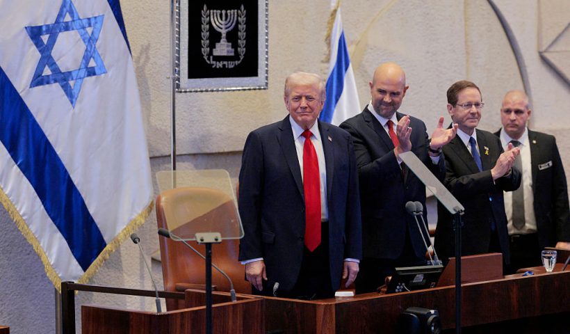 JERUSALEM - OCTOBER 13: U.S. President Donald Trump arrives to address the Knesset, Israel’s parliament, with Amir Ohana, Speaker of the Israeli Knesset, and Israeli President Isaac Herzog on October 13, 2025 in Jerusalem. President Trump is visiting the country hours after Hamas released some of the remaining Israeli hostages captured on Oct. 7, 2023, part of a US-brokered ceasefire deal to end the war in the Gaza Strip. (Photo by Chip Somodevilla/Getty Images)