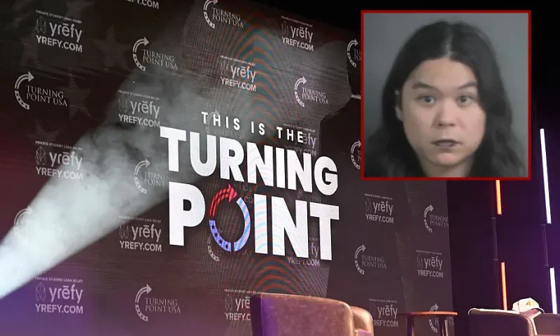The Turning Point USA logo is seen on the stage during an "American Comeback Tour" stop in Burruss Hall at Virgina Tech university in Blacksburg, Virginia, on September 24, 2025. The event is being held two weeks after the killing of right-wing activist and co-founder of Turning Point USA Charlie Kirk during an "American Comeback Tour" stop in Orem, Utah on September 10. (Photo by Alex WROBLEWSKI / AFP) (Photo by ALEX WROBLEWSKI/AFP via Getty Images) / Justin Pham Calhoon