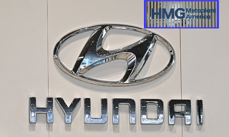 (Background) The logo of Hyundai Motor is seen at a car dealership in Seoul on March 27, 2024. Hyundai on March 27, revealed plans to invest more than 50 billion USD in South Korea by 2026, with a huge chunk dedicated to boosting the development and production of electric vehicles. (Photo by Jung Yeon-je / AFP) (Photo by JUNG YEON-JE/AFP via Getty Images) / (R) HMG Metaplant America logo.