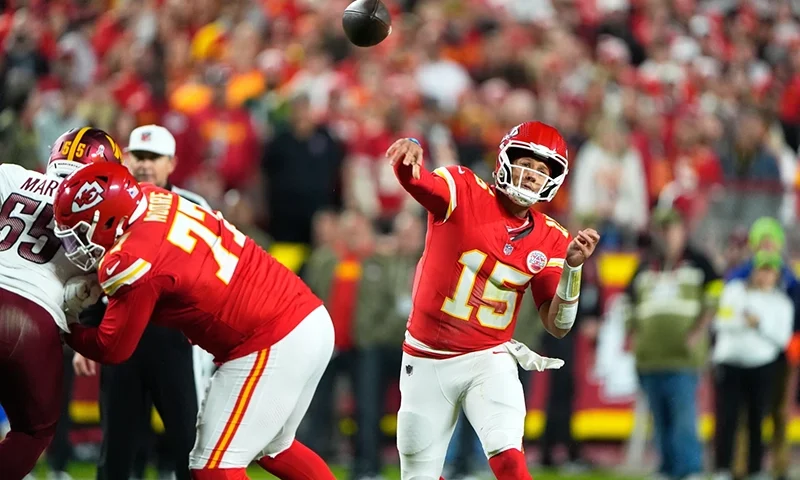 Kansas City Chiefs quarterback Patrick Mahomes (15) throws during the first half of an NFL football game against the Washington Commanders Monday, Oct. 27, 2025, in Kansas City, Mo. (AP Photo/Charlie Riedel)