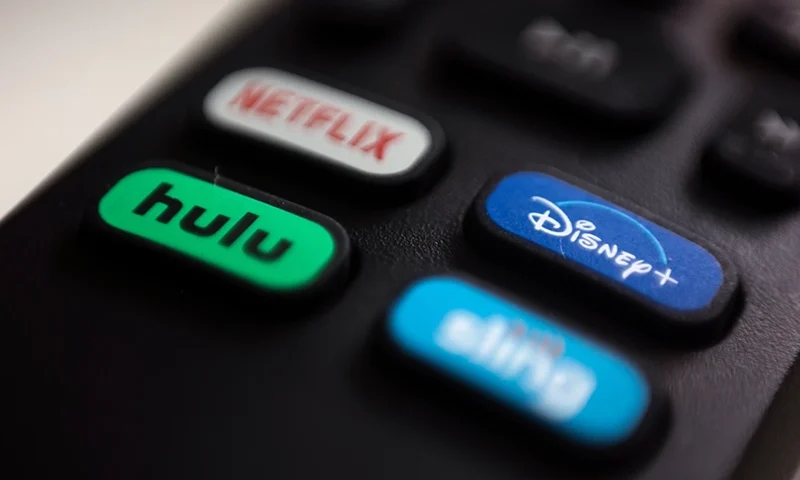 The logos for streaming services Netflix, Hulu, Disney Plus and Sling TV are pictured on a remote control on Aug. 13, 2020, in Portland, Ore. (AP Photo/Jenny Kane, File)