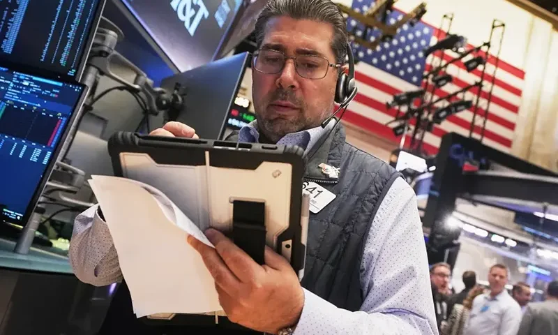 Trader Michael Capolino works on the floor of the New York Stock Exchange, Wednesday, Oct. 15, 2025. (AP Photo/Richard Drew)