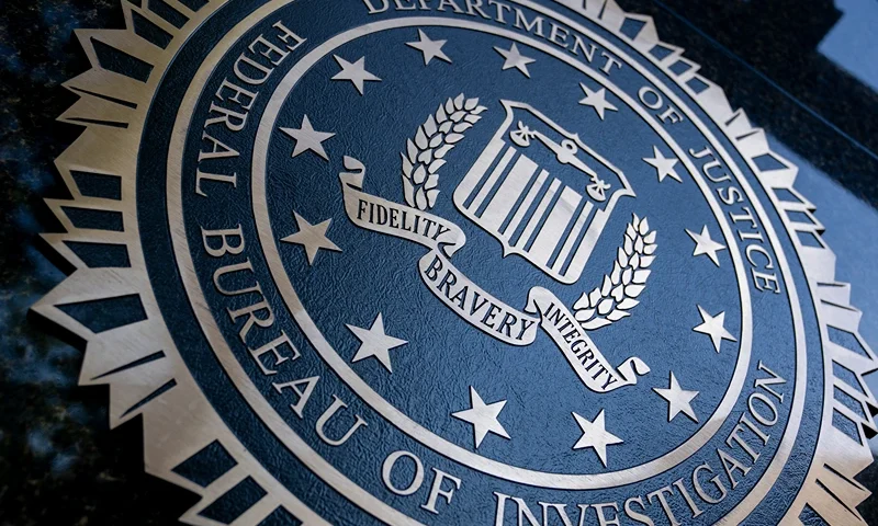 A seal reading "Department of Justice Federal Bureau of Investigation" is displayed on the J. Edgar Hoover FBI building in Washington, DC, o August 9, 2022. (Photo by Stefani Reynolds / AFP) (Photo by STEFANI REYNOLDS/AFP via Getty Images)