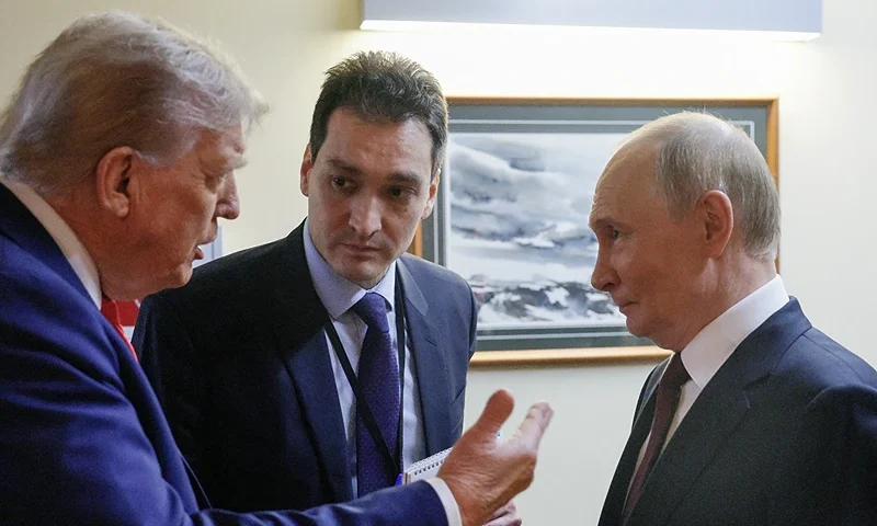 In this pool photograph distributed by the Russian state agency Sputnik, US President Donald Trump (L) and Russian President Vladimir Putin (R) chat before holding a joint press conference following a US-Russia summit on Ukraine at Joint Base Elmendorf-Richardson in Anchorage, Alaska, on August 15, 2025. (Photo by Gavriil GRIGOROV / POOL / AFP) (Photo by GAVRIIL GRIGOROV/POOL/AFP via Getty Images)