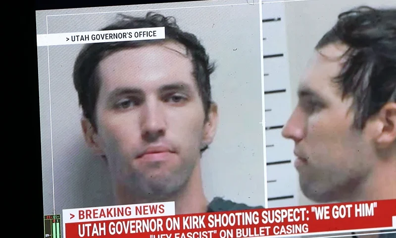 A TV monitor displays a picture of Tyler Robinson, the suspected of killing Charlie Kirk on September 11, in Orem, Utah, on September 12, 2025. US President Donald Trump on Friday announced that the suspect had been taken into custody over the killing of right-wing activist Charlie Kirk after a massive manhunt. (Photo by Patrick T. Fallon / AFP) (Photo by PATRICK T. FALLON/AFP via Getty Images)