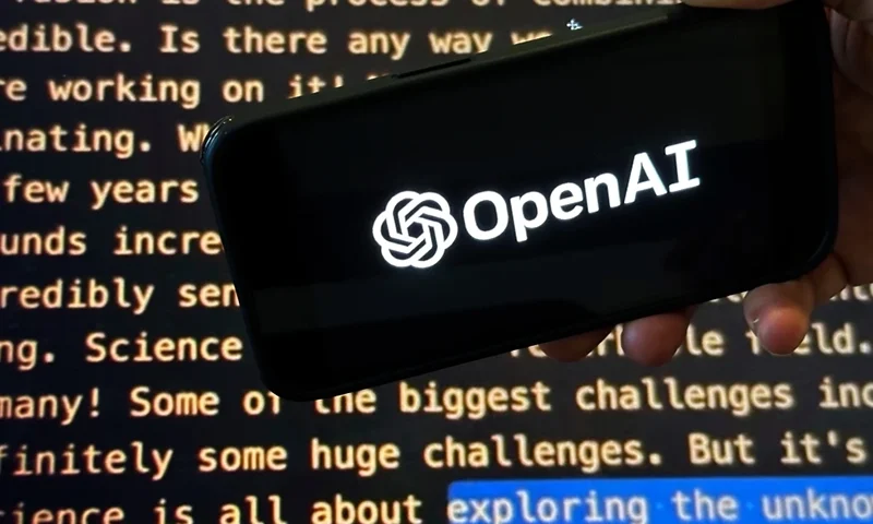 The OpenAI logo appears on a mobile phone in front of a screen showing part of the company website in this photo taken on Nov. 21, 2023 in New York. (AP Photo/Peter Morgan, File)