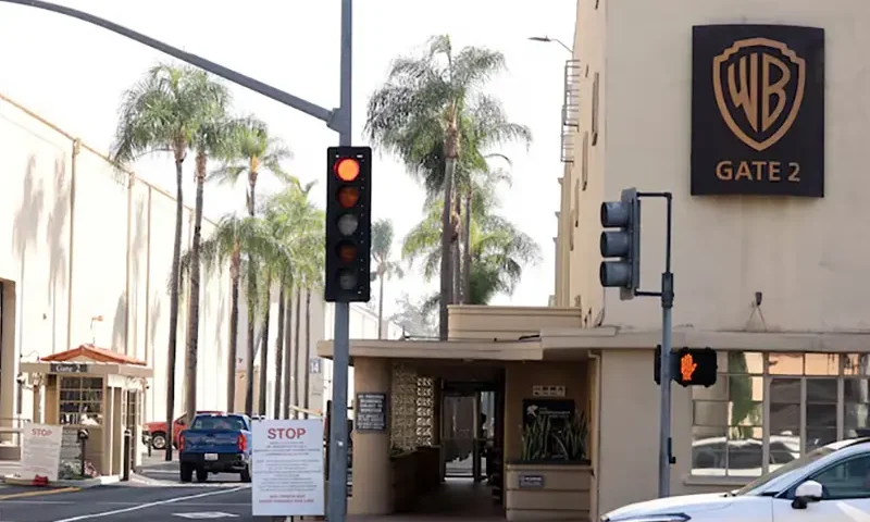 A vehicle drives through gate 2 at Warner Bros. Studios in Burbank, California, U.S., September 25, 2023. REUTERS/Mario Anzuoni