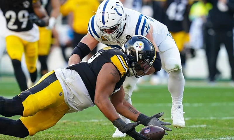 Pittsburgh Steelers defensive tackle Derrick Harmon (99) recovers a fumble in front of Indianapolis Colts guard Quenton Nelson (56) during the second half of an NFL football game in Pittsburgh, Sunday, Nov. 2, 2025. (AP Photo/Matt Freed)