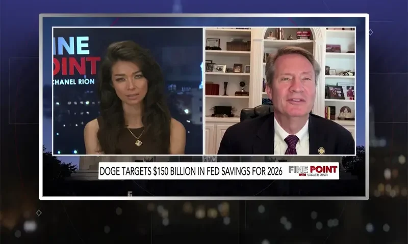 Video still from Fine Point on One America News Network showing a split screen of the host on the left side, and on the right side is the guest, Tim Burchett.